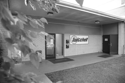 The front entrance of Twitchell Technical Products, black and white photo