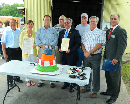 Twitchell Technical Products employees celebrating 90 years of business